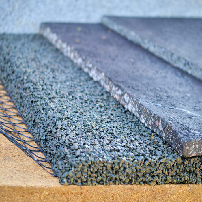 Layers of pavement when laying asphalt on the road and sidewalk. Sand, gravel and asphalt filled with tar