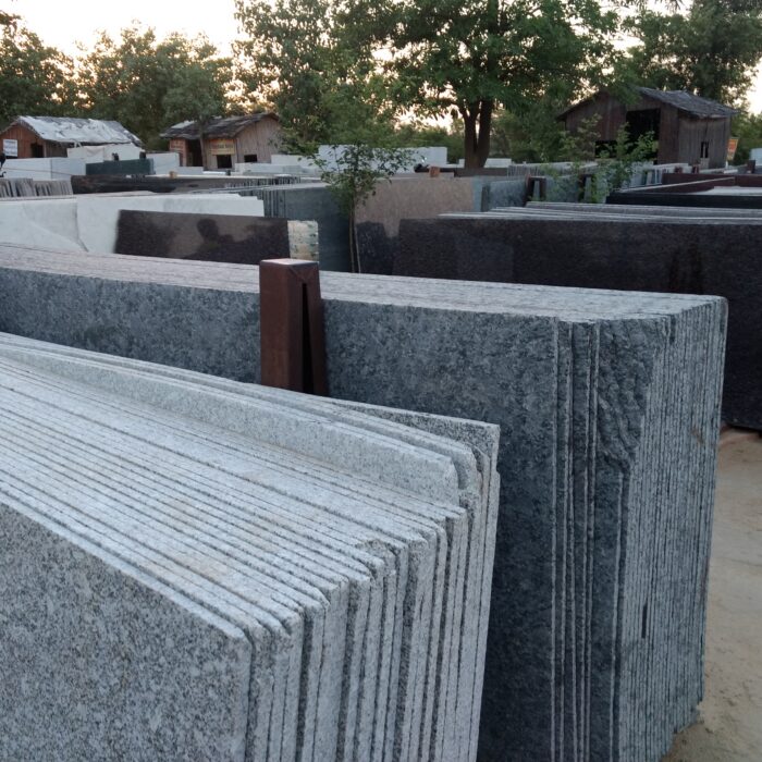 The gray granite slabs in an outdoor setting